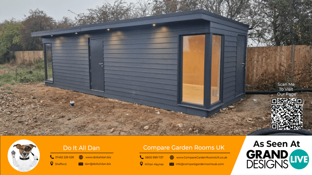 stunning grey garden room with dark grey bi folding doors on the corner of the room