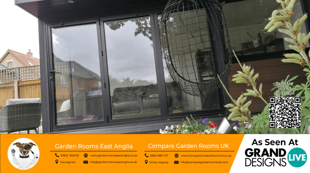 stunning black garden room with black french doors and windows