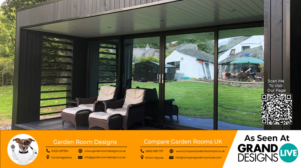 outdoor view of a beautiful garden room with black sliding doors and outdoor furniture