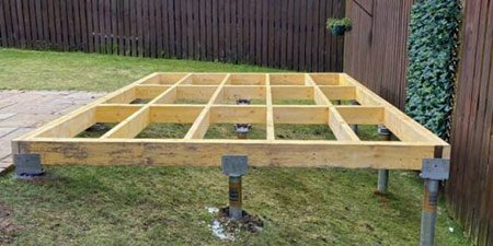 ground screw and timber base for garden room